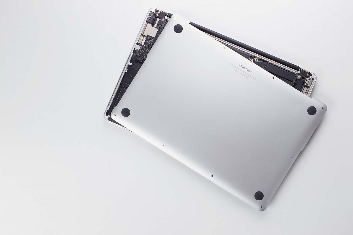 cell phone silver laptop computer on white surface mobile phone